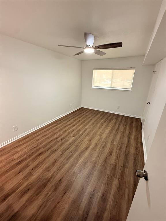 3933 Inwood Road, Unit 1023 Dallas, TX 75209 - Photo 14 of 22 wooden floor in an empty room