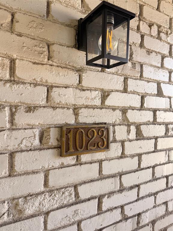 3933 Inwood Road, Unit 1023 Dallas, TX 75209 - Photo 19 of 22 a white wall with glass windows