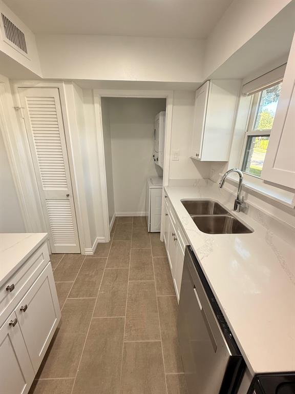 3933 Inwood Road, Unit 1023 Dallas, TX 75209 - Photo 4 of 22 a kitchen with a sink a stove and cabinets