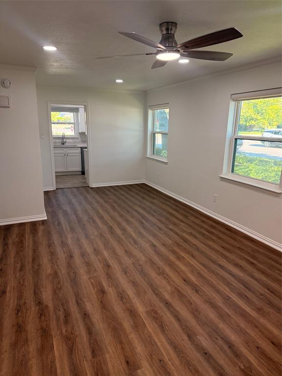 3933 Inwood Road, Unit 1023 Dallas, TX 75209 - Photo 5 of 22 a view of empty room with wooden floor and fan