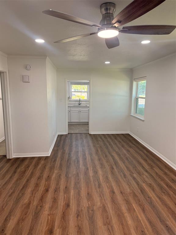 3933 Inwood Road, Unit 1023 Dallas, TX 75209 - Photo 6 of 22 a view of empty room with wooden floor and fan