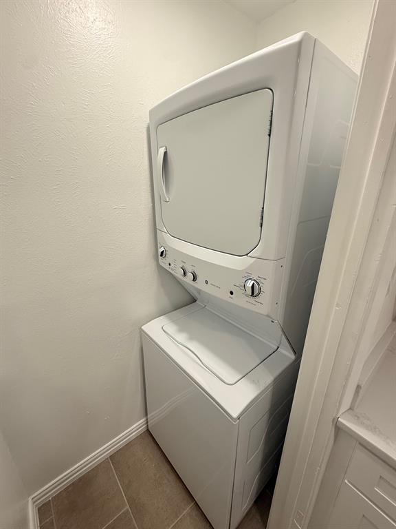 3933 Inwood Road, Unit 1023 Dallas, TX 75209 - Photo 7 of 22 a utility room with dryer and washer