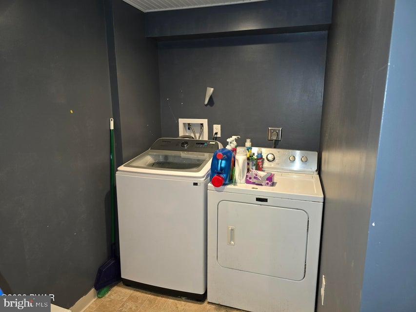 107 Keystone Hls Road, Unit 404 Factoryville, PA 18419 - Photo 27 of 27 Modern laundry space with sleek appliances.