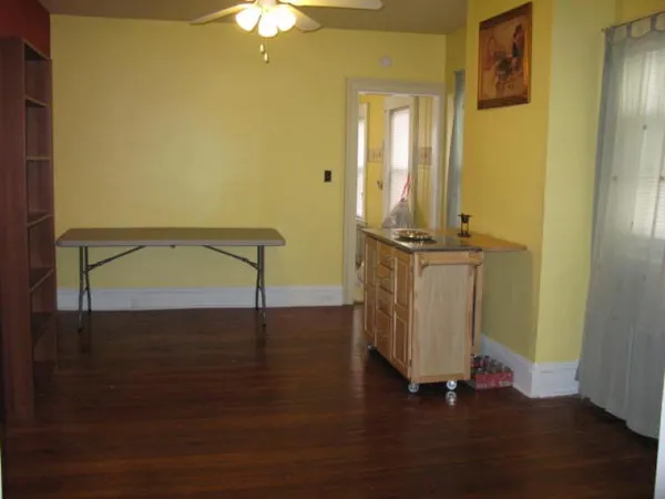 a view of living room with a bed and a chandelier
