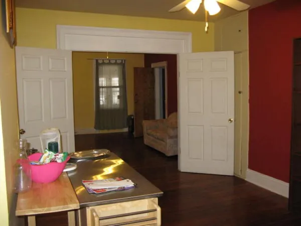 a room with a stove and a refrigerator
