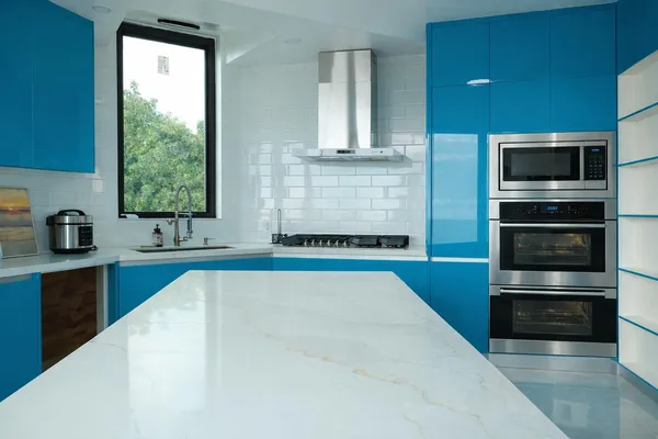 a kitchen with granite countertop a stove and a sink