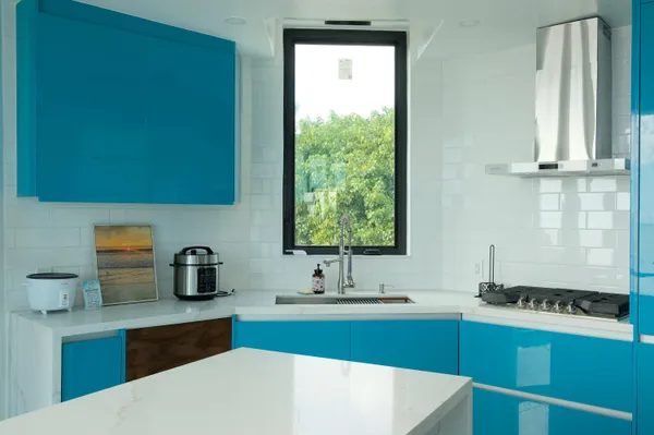 a bathroom with a glass door shower and a sink