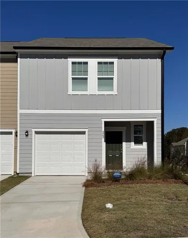 a front view of a house with a garage