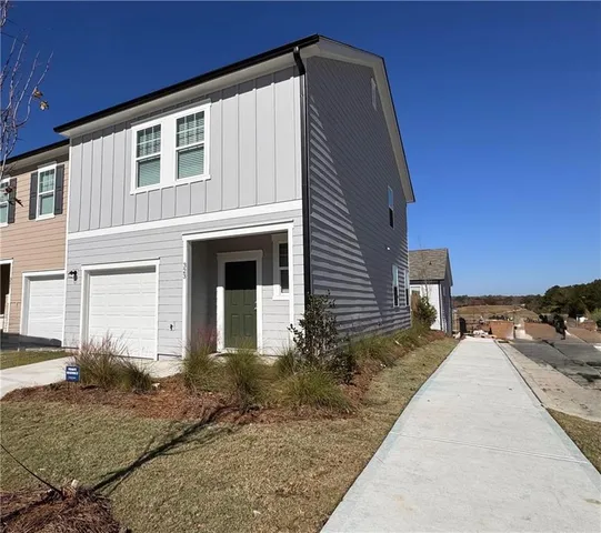 a front view of a house with a yard