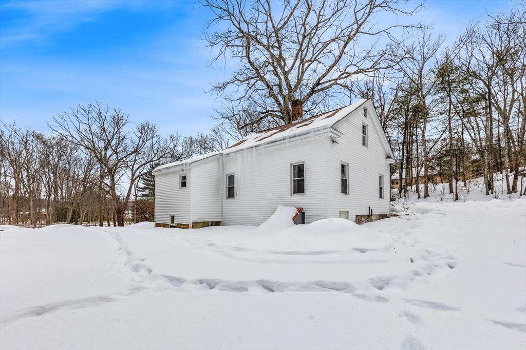 597 Mendon Road Northbridge, MA 01534 - Photo 12 of 13 a white house covered in snow