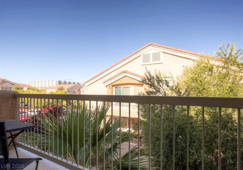 79 Stock Option Street, Unit 2 Henderson, NV 89074 - Photo 3 of 4 Enjoy scenic neighborhood views from this private balcony, perfect for relaxation.