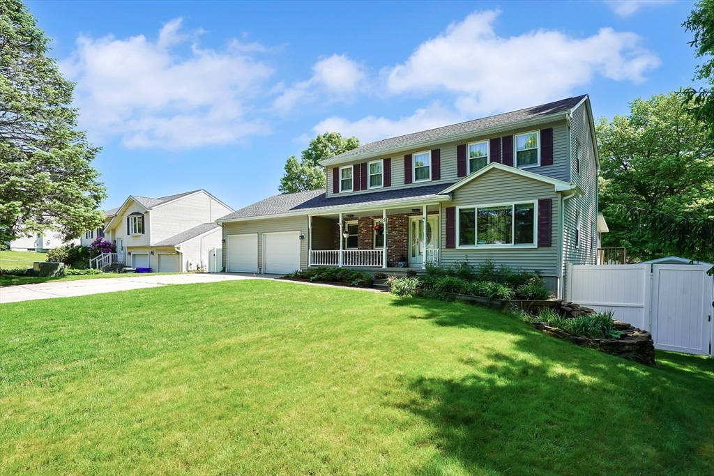 5 Flower Street Springfield, MA 01118 - Photo 2 of 42 a front view of a house with a yard