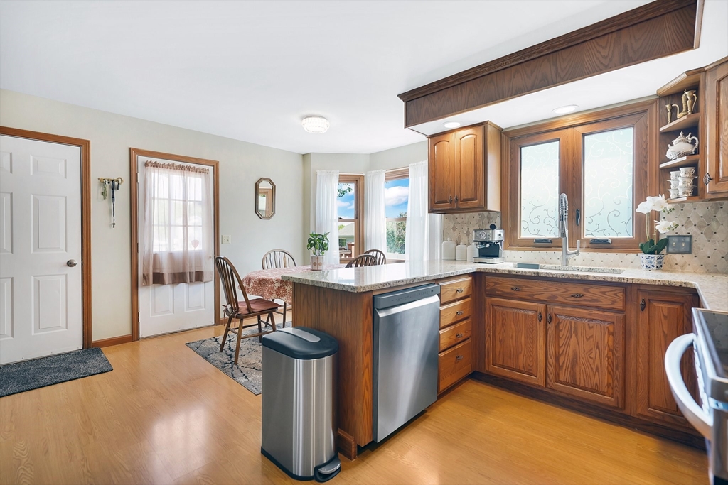 5 Flower Street Springfield, MA 01118 - Photo 21 of 42 a kitchen with a sink cabinets and wooden floor