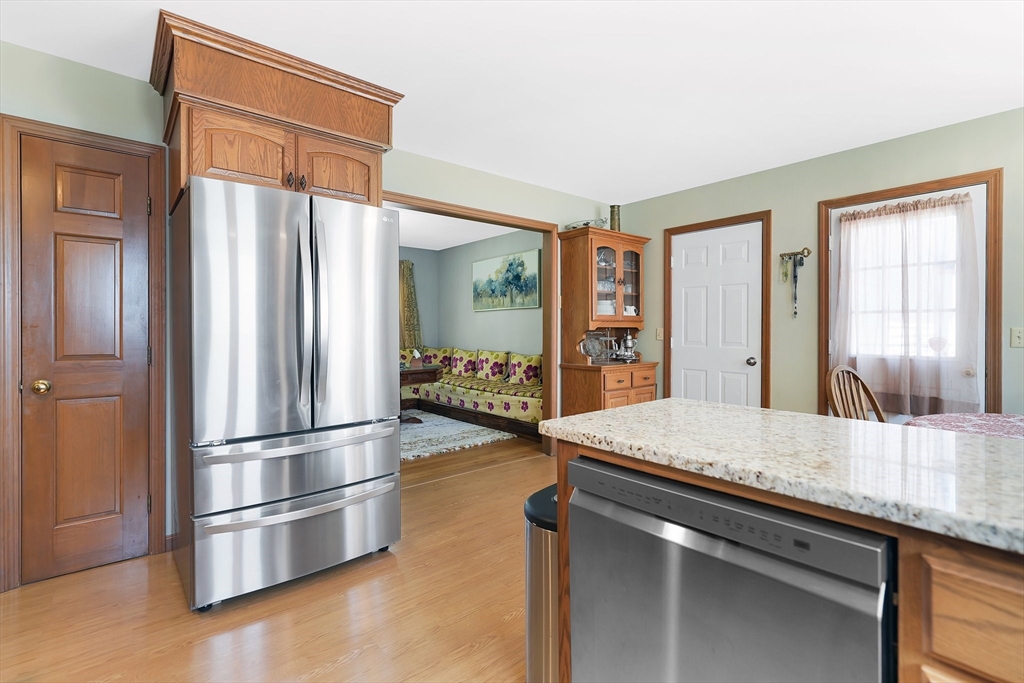 5 Flower Street Springfield, MA 01118 - Photo 22 of 42 a kitchen with stainless steel appliances granite countertop a refrigerator and a sink