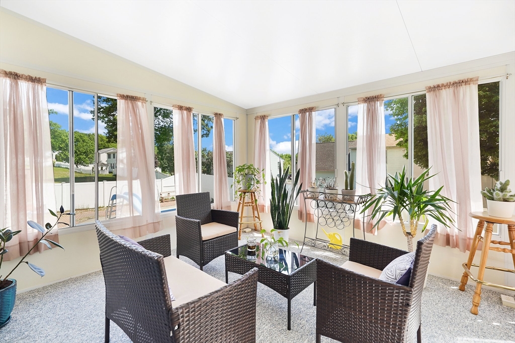 5 Flower Street Springfield, MA 01118 - Photo 29 of 42 a living room with furniture and large windows