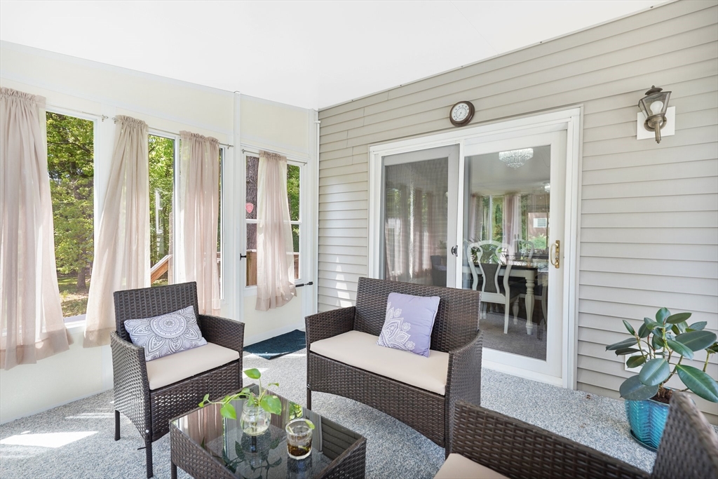 5 Flower Street Springfield, MA 01118 - Photo 30 of 42 a living room with furniture and a large window