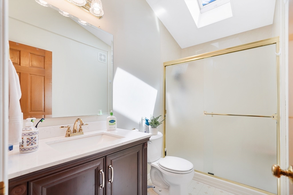 5 Flower Street Springfield, MA 01118 - Photo 35 of 42 a bathroom with a granite countertop sink toilet and shower