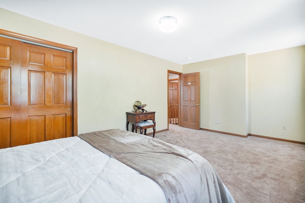 5 Flower Street Springfield, MA 01118 - Photo 39 of 42 a bedroom with a bed and a window