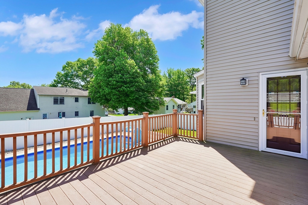 5 Flower Street Springfield, MA 01118 - Photo 4 of 42 a balcony with wooden floor and fence