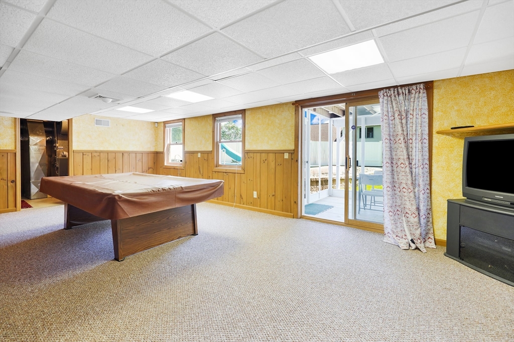 5 Flower Street Springfield, MA 01118 - Photo 41 of 42 a living room with furniture and a flat screen tv