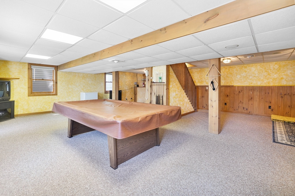 5 Flower Street Springfield, MA 01118 - Photo 42 of 42 a spacious bedroom with a large bed and a large window