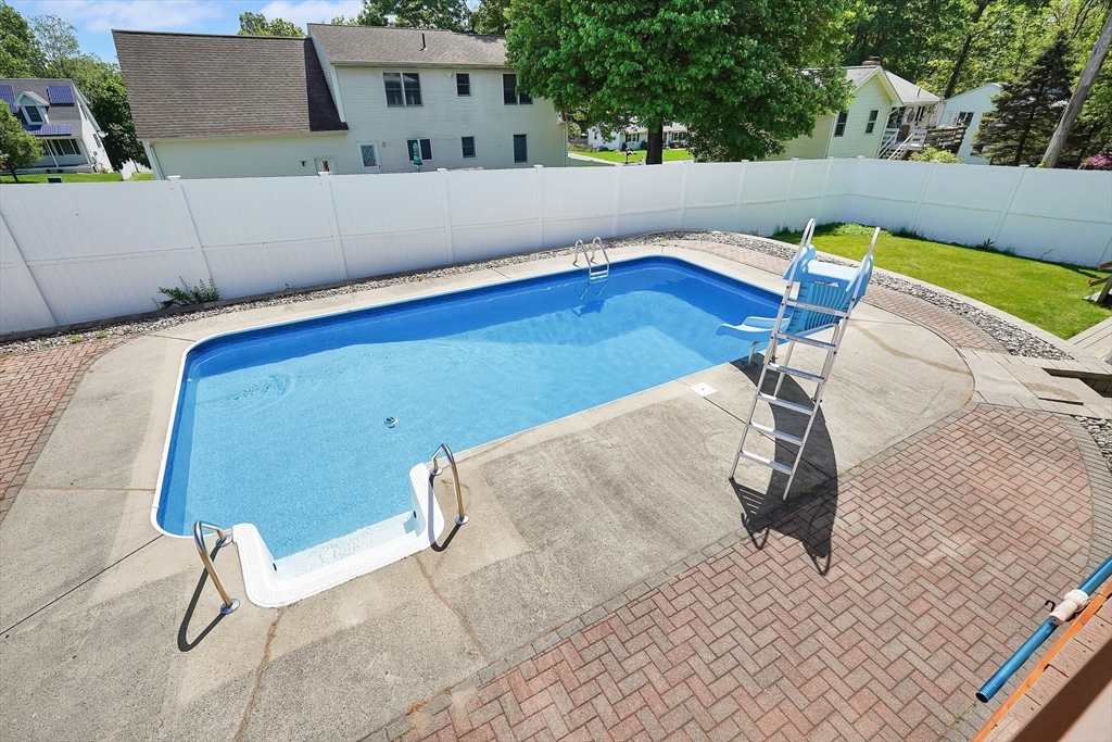 5 Flower Street Springfield, MA 01118 - Photo 5 of 42 a view of a swimming pool with a lounge chair