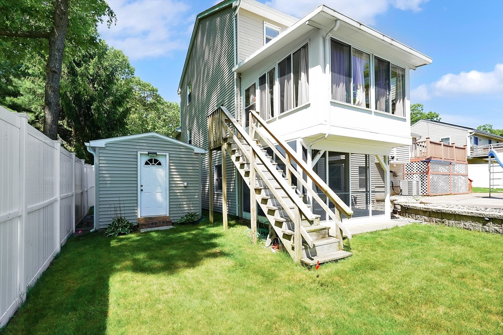 5 Flower Street Springfield, MA 01118 - Photo 9 of 42 a view of a house with a yard and deck