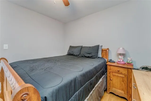 a bedroom with a bed and cabinets