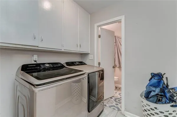 a white stove top oven sitting inside of a kitchen