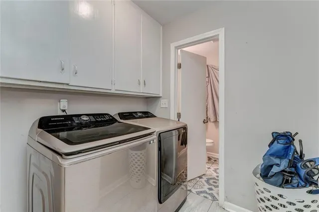 a white stove top oven sitting inside of a kitchen