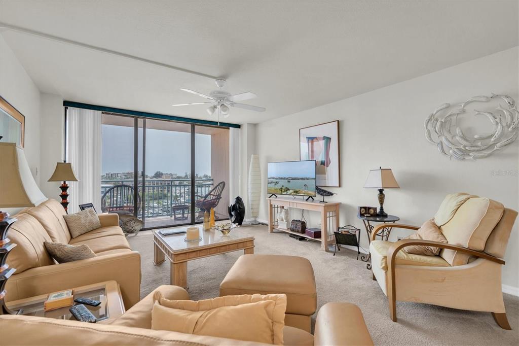 1 Key Capri, Unit 502E Treasure Island, FL 33706 - Photo 13 of 51 a living room with furniture and a large window