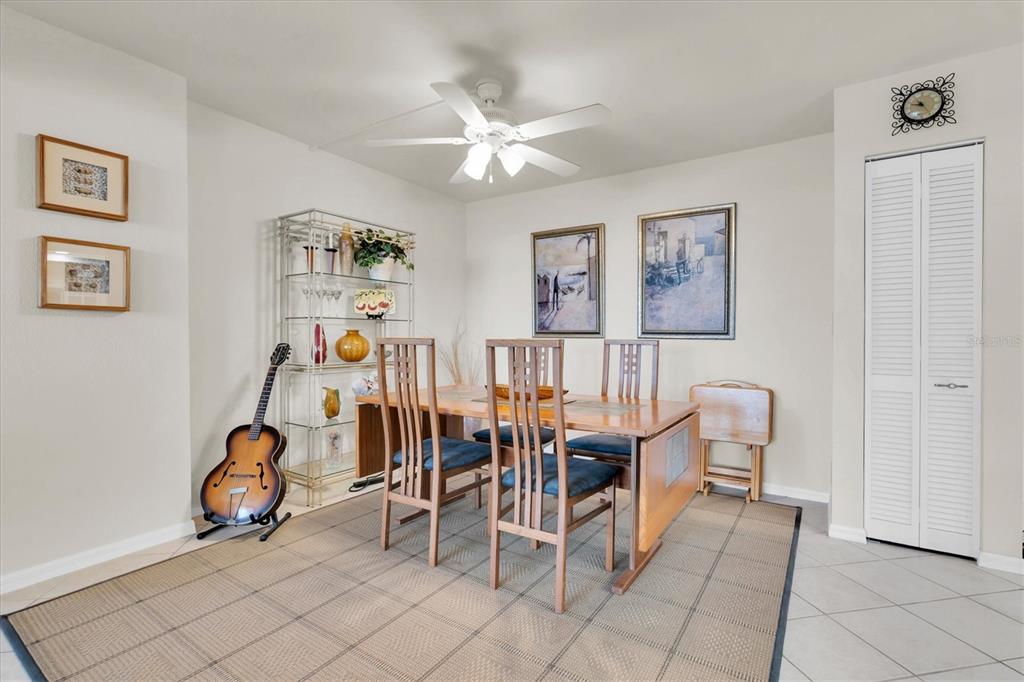1 Key Capri, Unit 502E Treasure Island, FL 33706 - Photo 14 of 51 a view of a livingroom with furniture and a chandelier