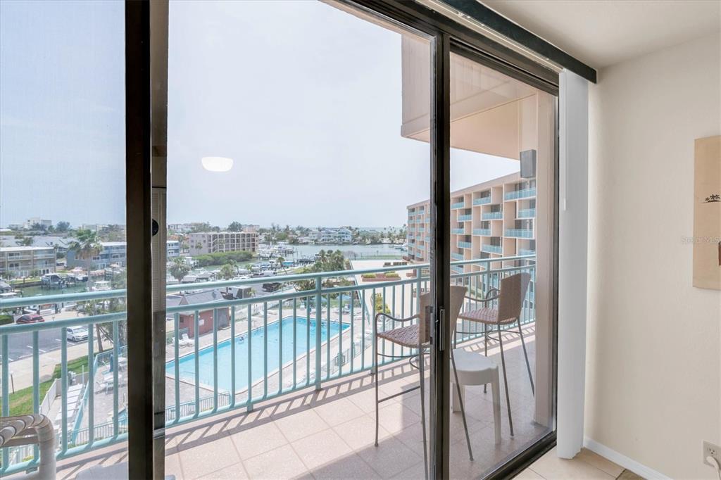 1 Key Capri, Unit 502E Treasure Island, FL 33706 - Photo 16 of 51 a view of a glass door from a window