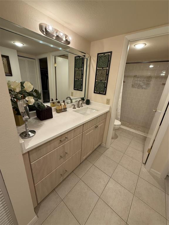 1 Key Capri, Unit 502E Treasure Island, FL 33706 - Photo 20 of 51 a bathroom with a double vanity sink mirror and