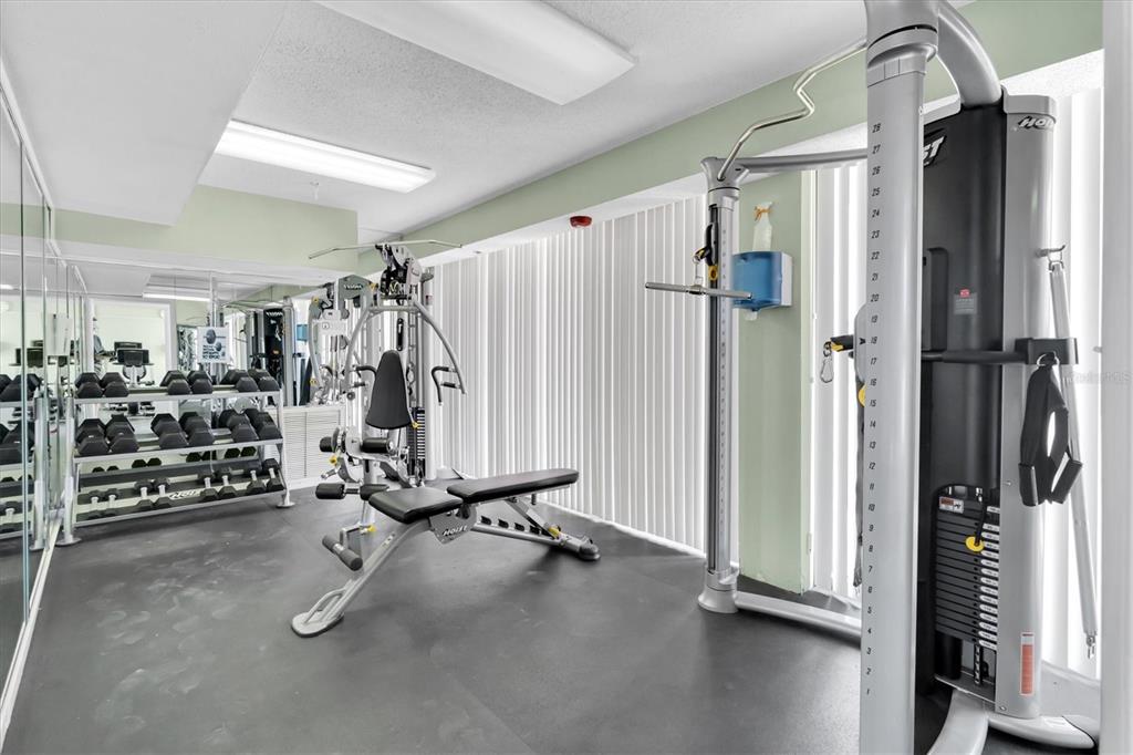 1 Key Capri, Unit 502E Treasure Island, FL 33706 - Photo 30 of 51 a view of a room with gym equipment
