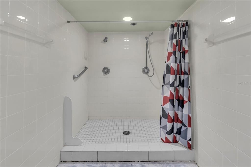 1 Key Capri, Unit 502E Treasure Island, FL 33706 - Photo 33 of 51 a bathroom with a shower and a sink