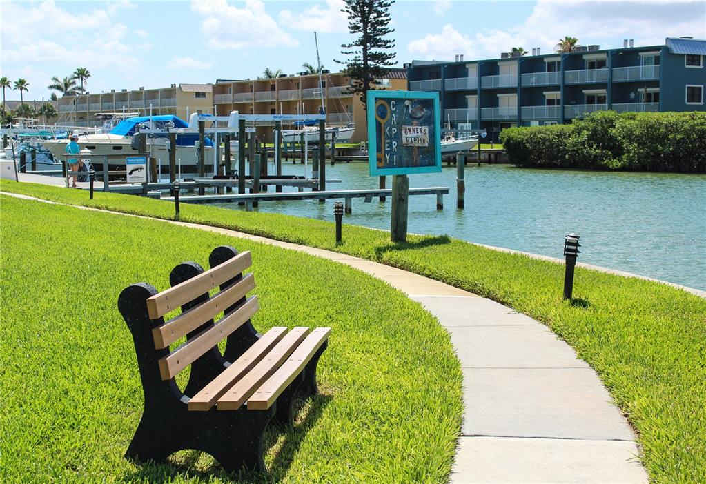 1 Key Capri, Unit 502E Treasure Island, FL 33706 - Photo 39 of 51 a swimming pool with outdoor seating and lake view