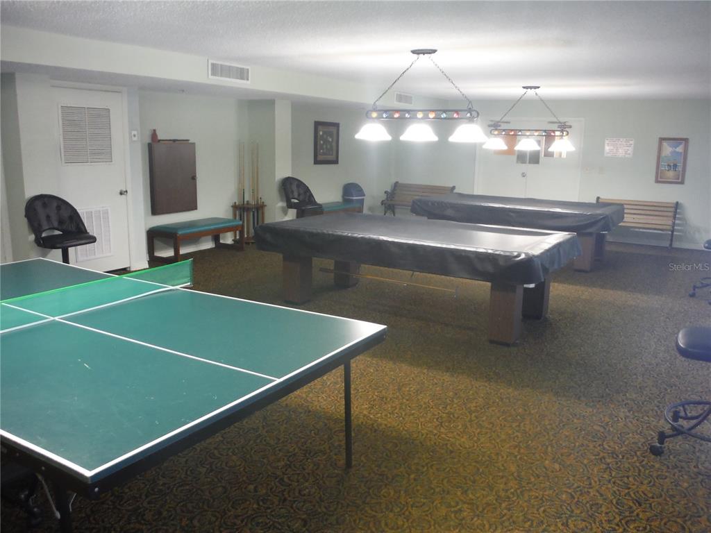1 Key Capri, Unit 502E Treasure Island, FL 33706 - Photo 44 of 51 a room with pool table and windows