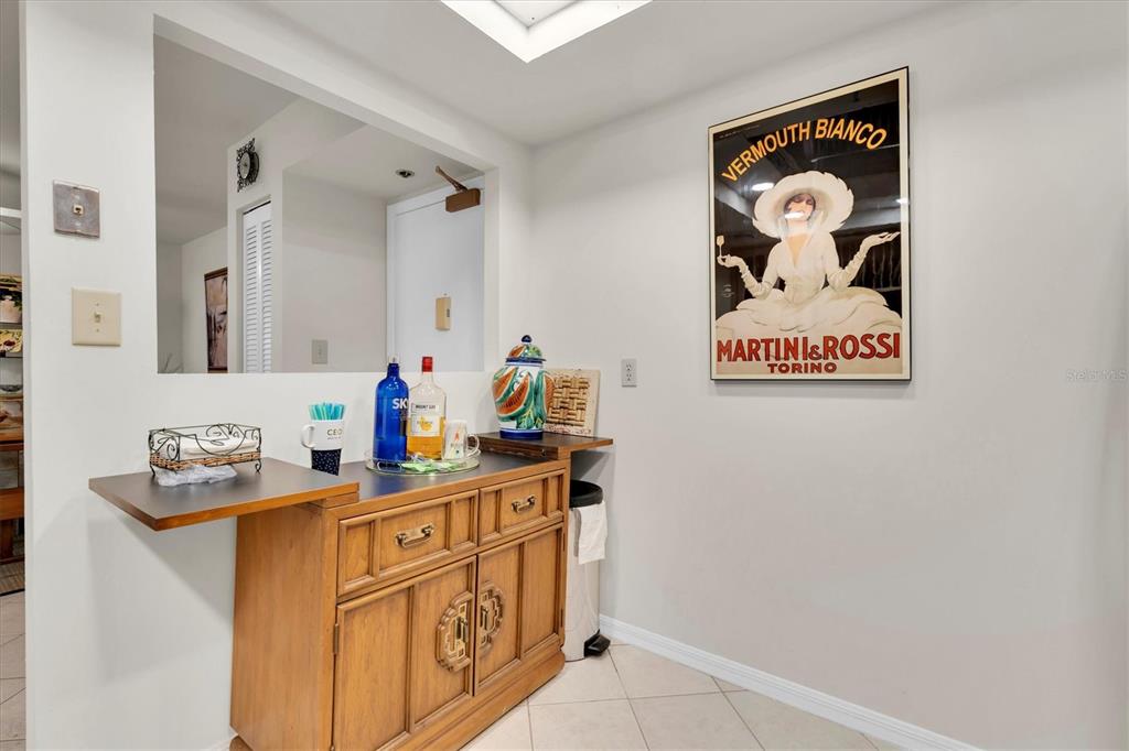 1 Key Capri, Unit 502E Treasure Island, FL 33706 - Photo 9 of 51 a bathroom with a sink a vanity and a mirror