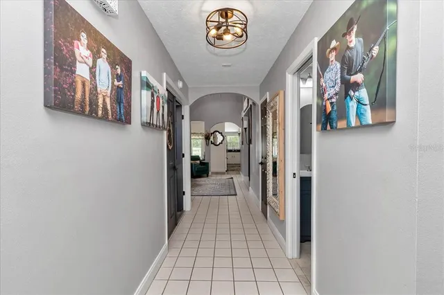 a view of a house with backyard porch and sitting area