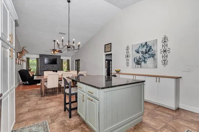 a view of a house with backyard porch and sitting area
