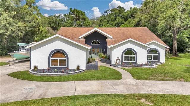 a front view of a house with a yard