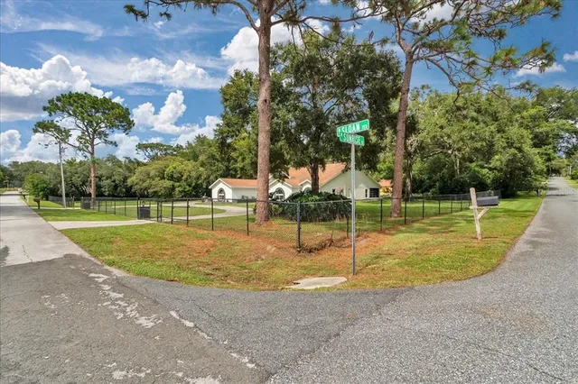 a room with pool table and windows