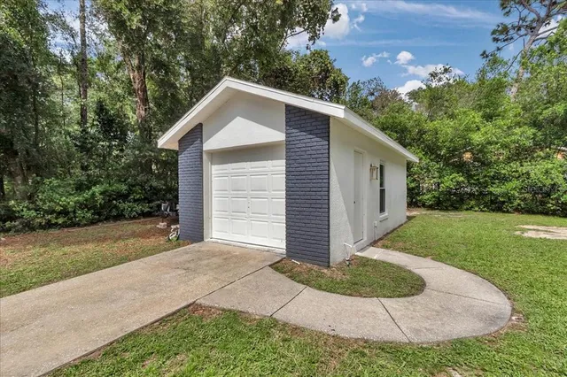 a room with pool table and windows