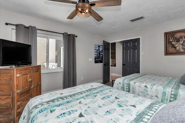 a large bathroom with a large mirror vanity and sink