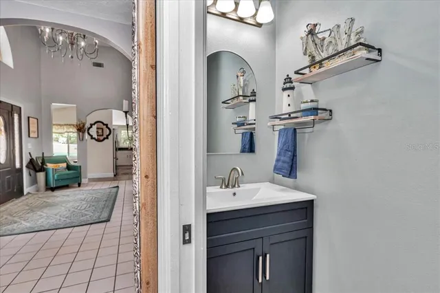 a utility room with sink dryer and washer