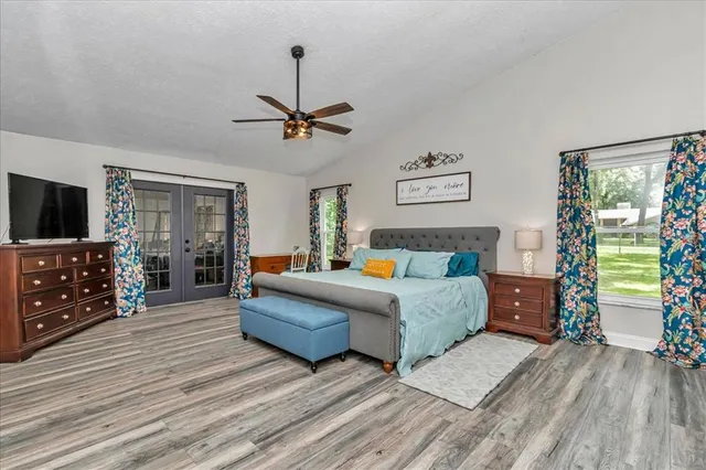 a bathroom with a granite countertop sink toilet and a mirror