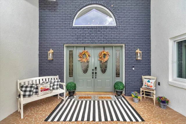 a view of a livingroom with furniture and a flat screen tv