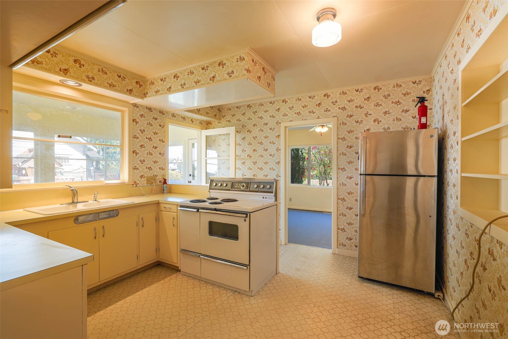 1320 4th Street Cosmopolis, WA 98537 - Photo 13 of 40 a kitchen with cabinets and stainless steel appliances