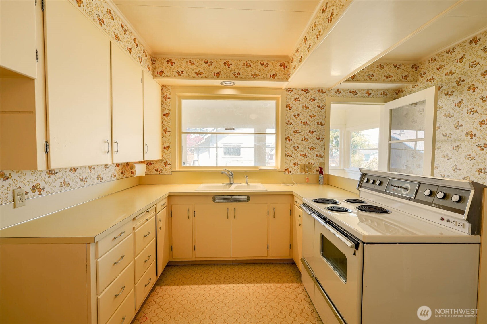 1320 4th Street Cosmopolis, WA 98537 - Photo 14 of 40 a kitchen with a sink stove and cabinets